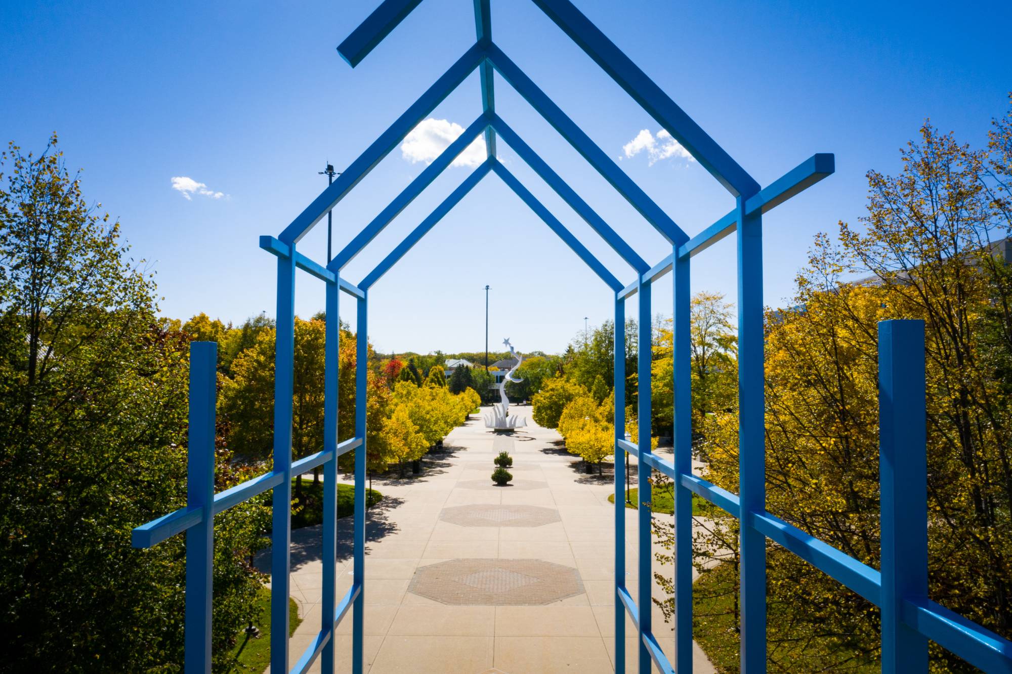 transformational link sculpture, 40 foot tall blue steel arch